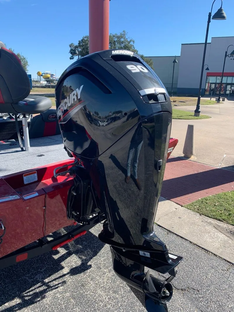 Slide: The Image of 2024 Ranger RT188 boat with Mercury 90 outboard motor in a parking lot. - 3