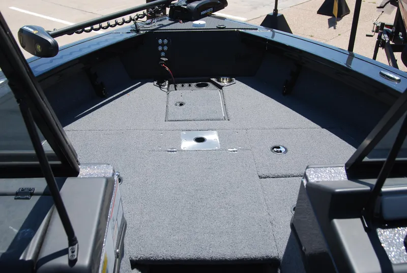 Slide: The Image of 2024 Ranger VX1888 WT boat interior with carpeted deck and mounted equipment. - 3