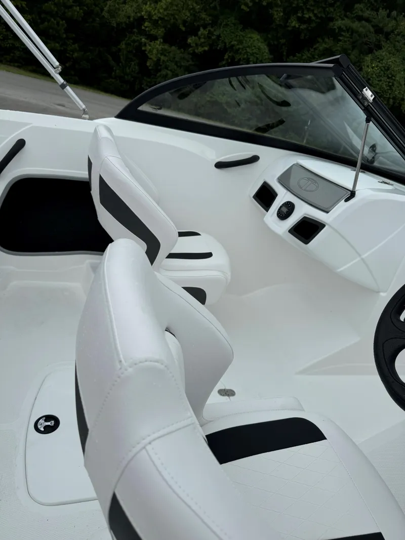 Slide: The Image of 2024 Tahoe 185 S boat interior with sleek white and black seating. - 5