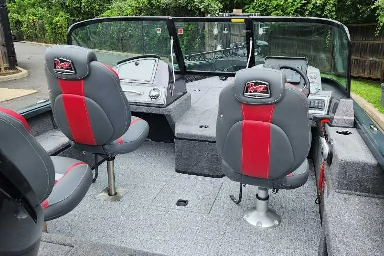Slide: The Image of 2024 Ranger VS1682SC Angler boat interior with gray and red seating. - 3