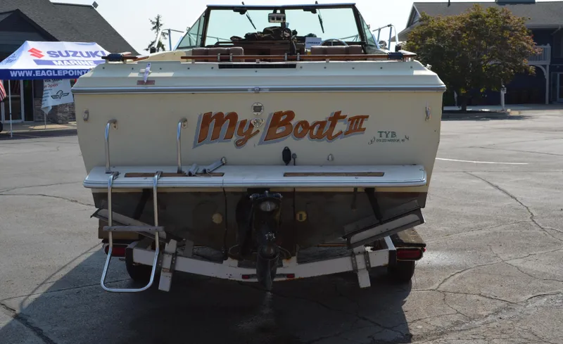 Slide: The Image of 1981 Sea Ray V240 boat named "My Boat III" parked on a trailer. - 2
