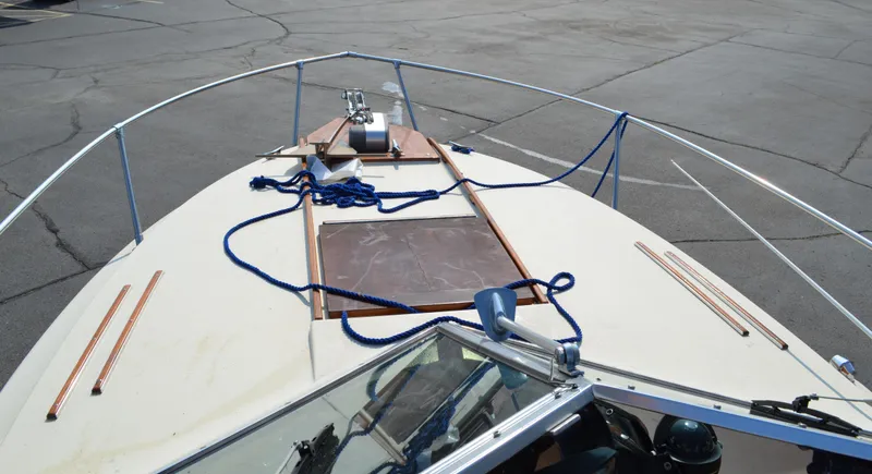 Slide: The Image of 1981 Sea Ray V240 boat deck with blue ropes and anchor. - 3