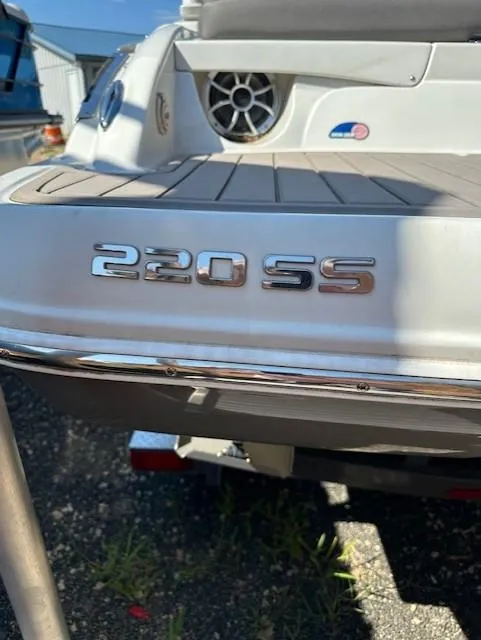 Slide: The Image of 2021 Crownline 220SS boat rear view with model emblem. - 4