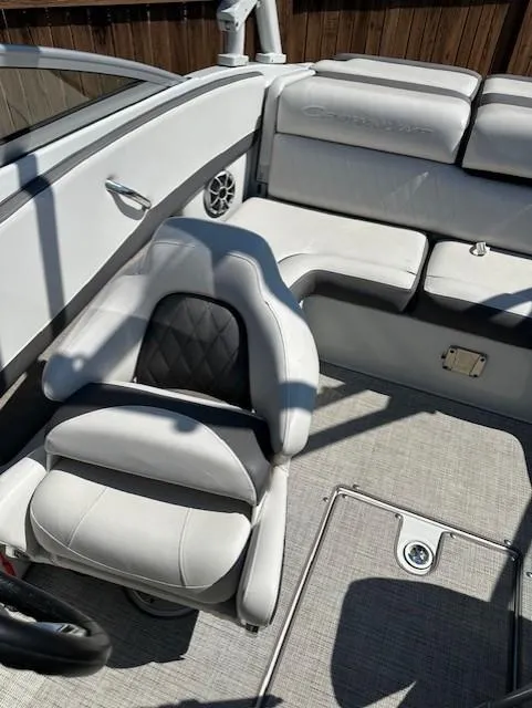Slide: The Image of 2021 Crownline 220SS boat interior with white seating and modern design. - 8