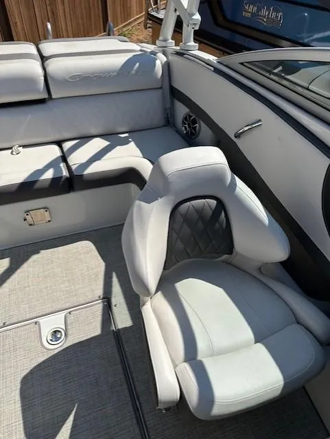 Slide: The Image of 2021 Crownline 220SS boat interior with plush seating and modern design. - 9