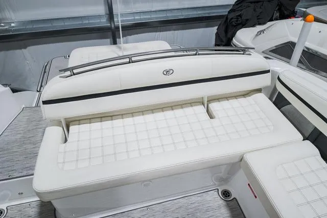 Slide: The Image of 2021 Cobalt R5 Surf boat interior with white cushioned seating. - 11