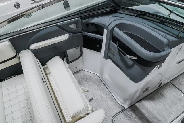 Slide: The Image of 2021 Cobalt R5 Surf boat interior with white seating and sleek design. - 18