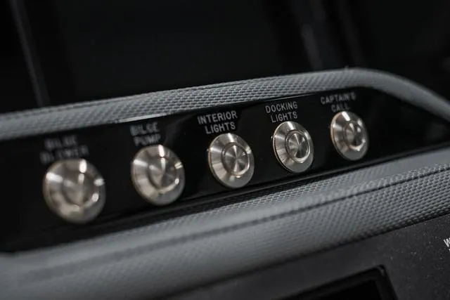 Slide: The Image of Control panel of 2021 Cobalt R5 Surf boat with labeled switches. - 23