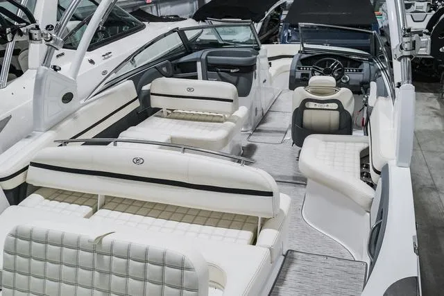 Slide: The Image of 2021 Cobalt R5 Surf boat interior with luxurious white seating and modern dashboard. - 5
