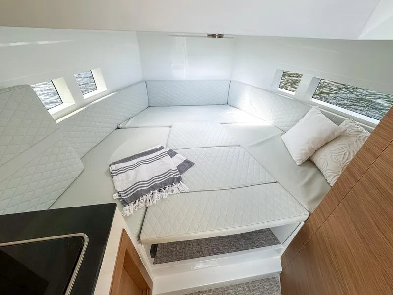 Slide: The Image of 2024 De Antonio Yachts D28 Cruiser interior with cozy seating and elegant design. - 11