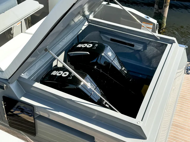 Slide: The Image of 2024 De Antonio Yachts D28 Cruiser with dual outboard engines in open compartment. - 18