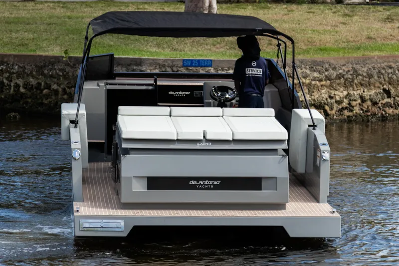 Slide: The Image of 2024 De Antonio Yachts D28 Cruiser on water, rear view with canopy and seating. - 21