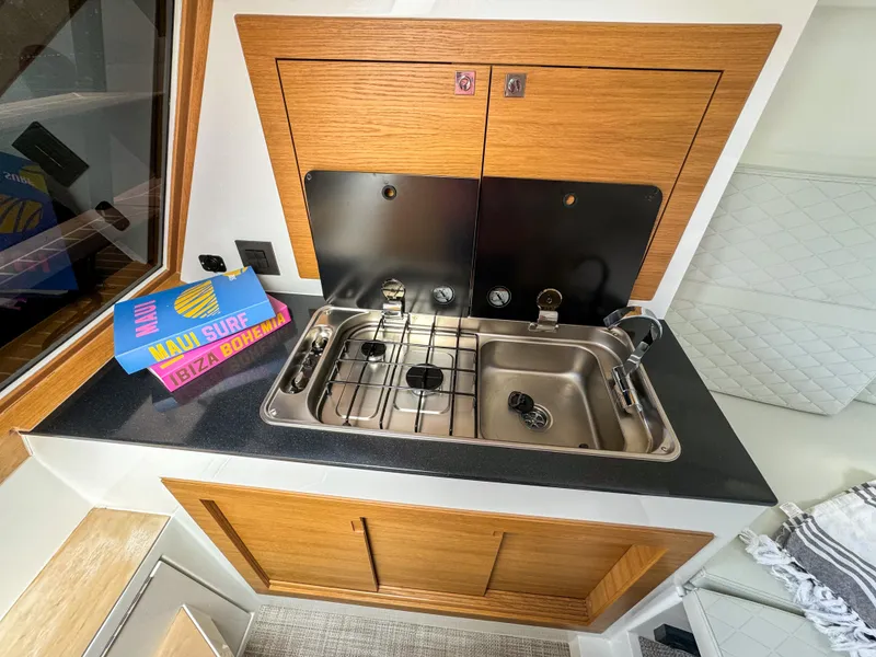 Slide: The Image of Kitchen area of 2024 De Antonio Yachts D28 Cruiser with sink and stove. - 7