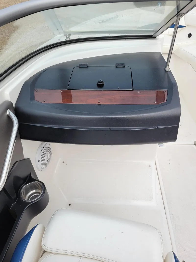 Slide: The Image of 2008 Regal ES2000 boat interior with dashboard, cup holder, and seating area. - 10