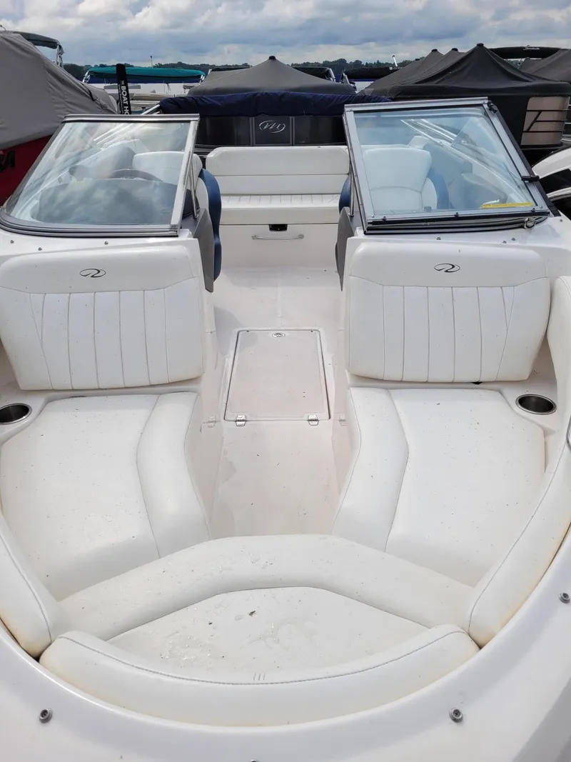 Slide: The Image of 2008 Regal ES2000 boat interior with white seating and open cockpit. - 5
