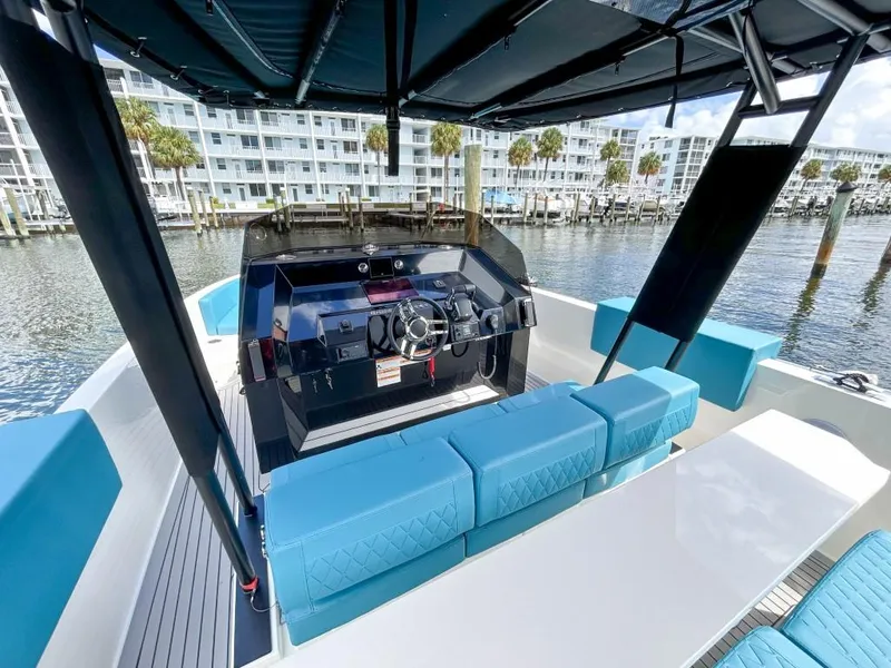 Slide: The Image of 2023 De Antonio Yachts D28 Open with modern helm and seating, docked in marina. - 13