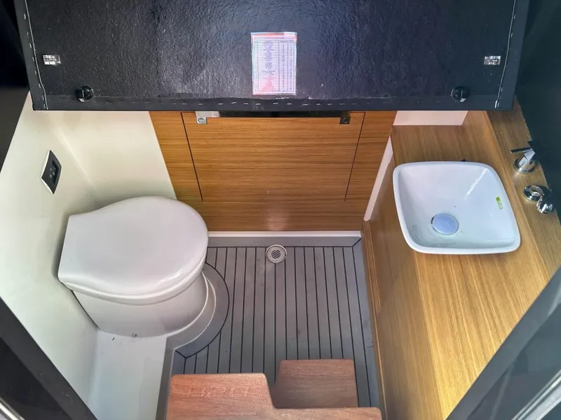 Slide: The Image of Modern bathroom interior of 2023 De Antonio Yachts D28 Open, featuring wood accents and compact design. - 23