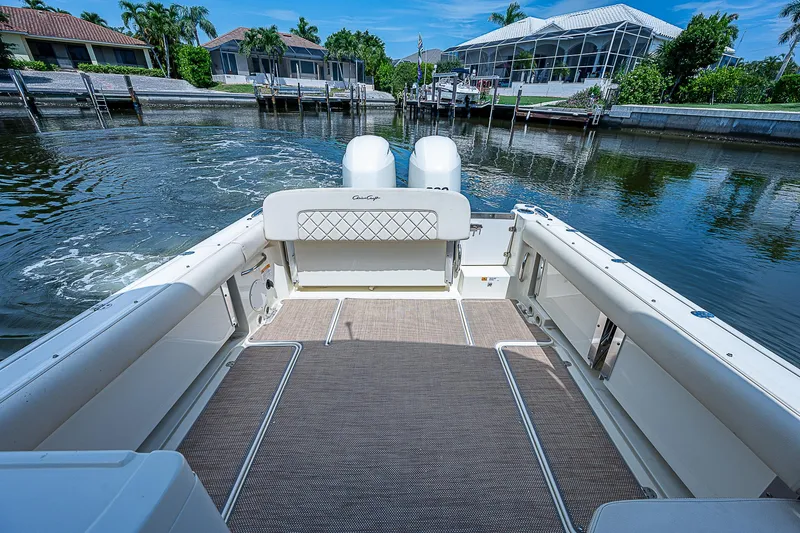 Slide: The Image of 2018 Chris-Craft Calypso 26 boat interior with waterfront view. - 17