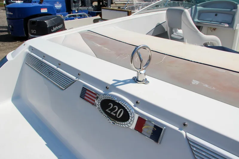 Slide: The Image of 1996 Cobalt 220 boat interior with emblem and seating. - 15