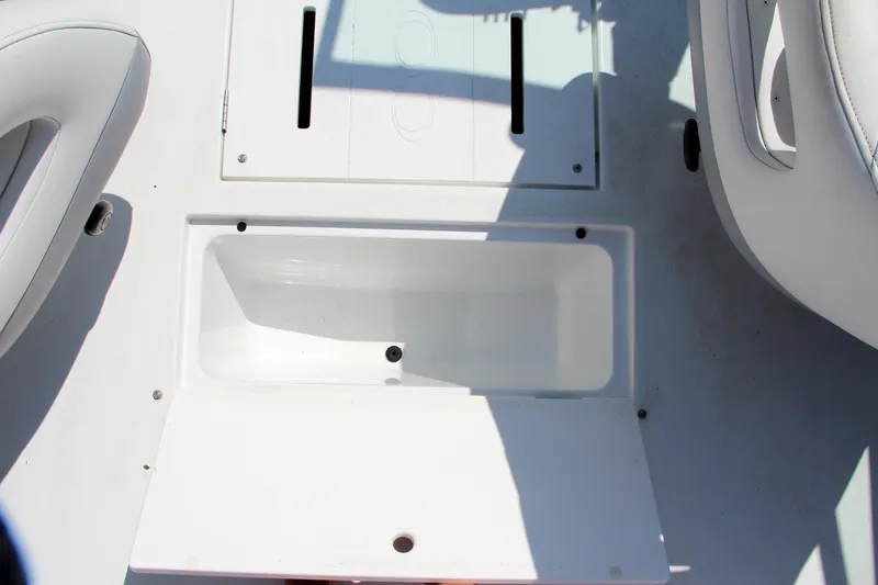 Slide: The Image of Open storage compartment on 1996 Cobalt 220 boat deck. - 23