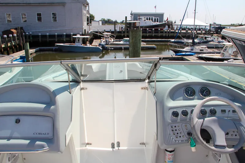 Slide: The Image of 1996 Cobalt 220 boat dashboard with marina view in the background. - 4