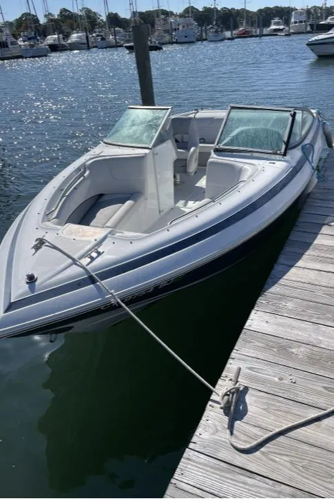 Slide: The Image of 1996 Cobalt 220 boat docked at marina on sunny day. - 8