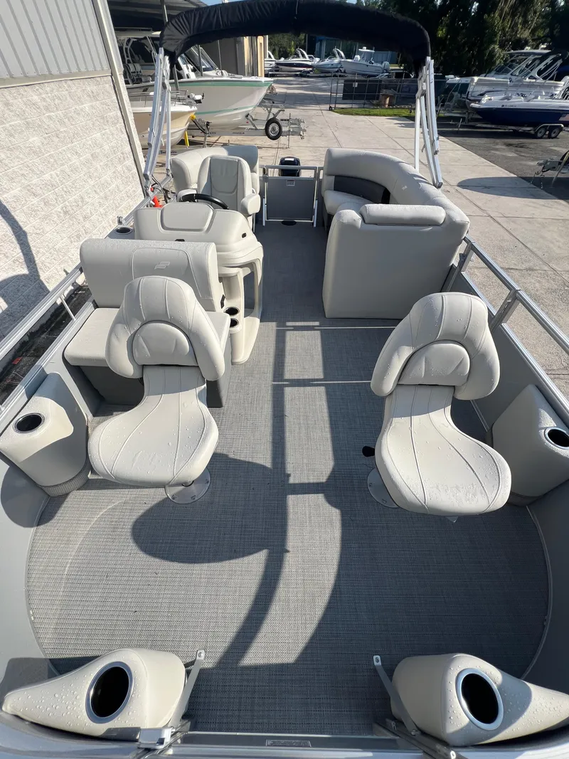 Slide: The Image of 2025 Starcraft LX 18 F pontoon boat with spacious seating and modern design. - 13