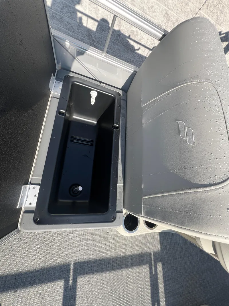 Slide: The Image of 2025 Starcraft LX 18 F boat seat with storage compartment, gray upholstery, and cup holders. - 14