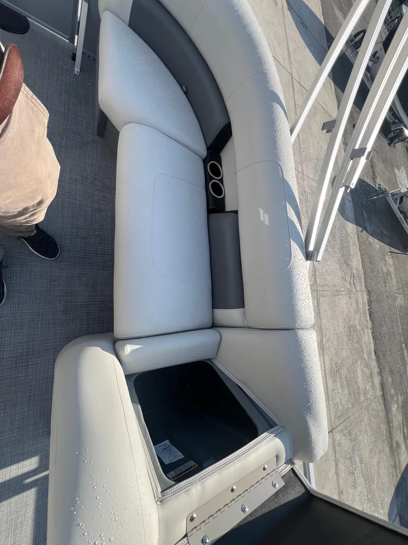Slide: The Image of 2025 Starcraft LX 18 F boat interior with white seating and cup holders. - 7