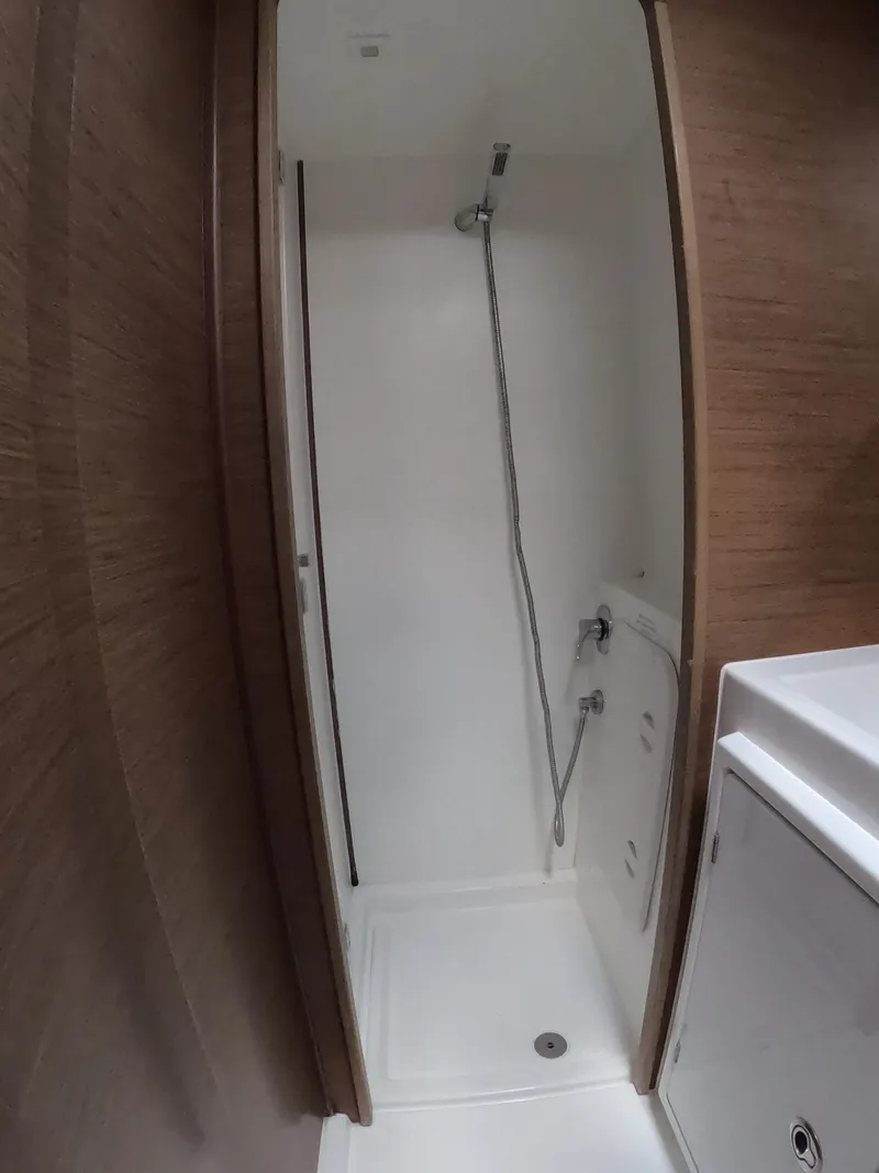 Slide: The Image of Shower area in 2019 Lagoon 42 catamaran, featuring sleek design and modern fixtures. - 29