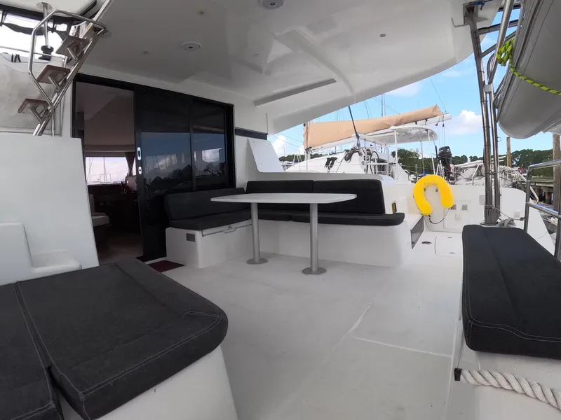Slide: The Image of Spacious deck of 2019 Lagoon 42 catamaran with seating and table. - 36