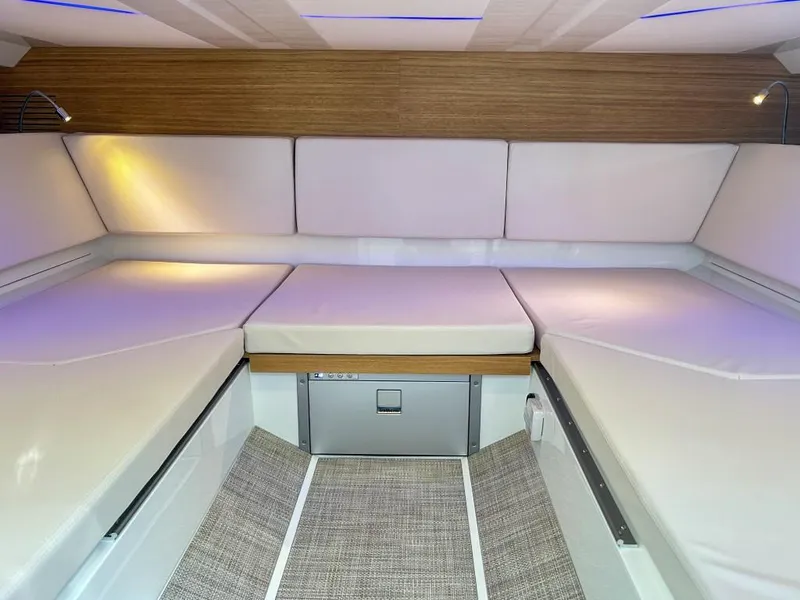 Slide: The Image of Luxurious interior of 2024 De Antonio Yachts D36 OPEN with modern seating and ambient lighting. - 13