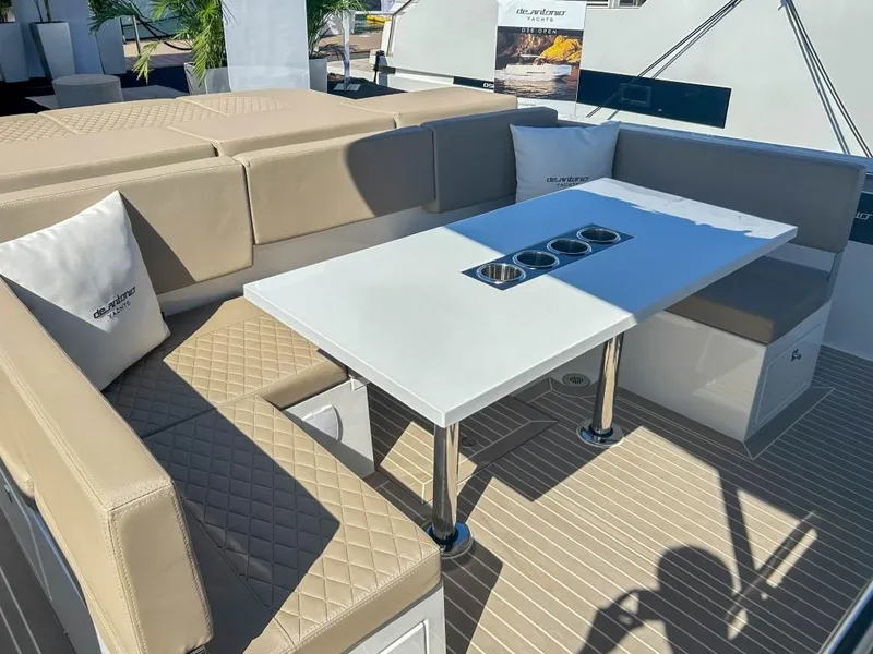 Slide: The Image of Luxurious seating area on 2024 De Antonio Yachts D36 OPEN with beige cushions and table. - 17