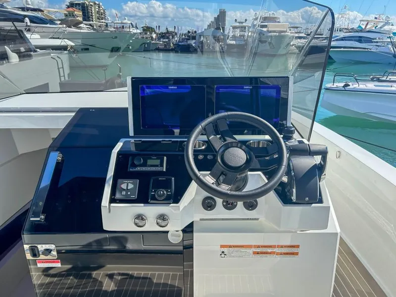 Slide: The Image of Helm of 2024 De Antonio Yachts D36 OPEN with modern navigation displays. - 8