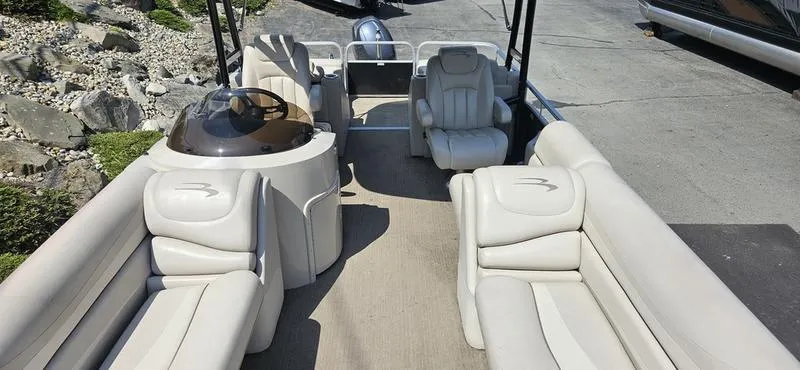 Slide: The Image of 2013 Bennington 2375 GCW pontoon boat with spacious seating and modern design. - 12