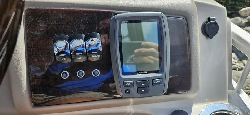 Slide: The Image of Control panel of 2013 Bennington 2375 GCW with Garmin display and switches. - 7