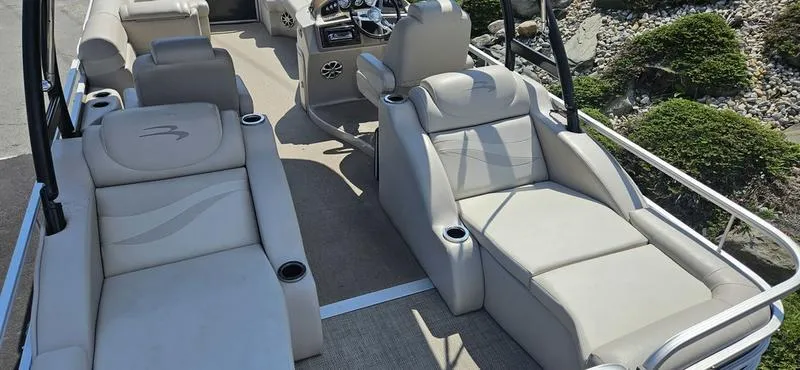 Slide: The Image of 2013 Bennington 2375 GCW pontoon boat interior with plush seating and modern design. - 9