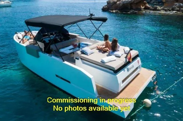 Slide: The Image of 2024 De Antonio Yachts D28 Open cruising in clear blue waters. - 2