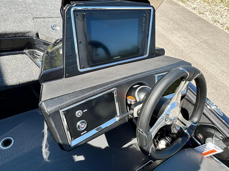 Slide: The Image of 2025 Ranger Z520R Garmin Ranger Cup boat dashboard with steering wheel and navigation display. - 11