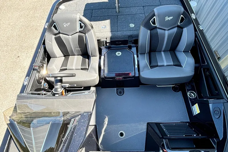 Slide: The Image of 2025 Ranger Z520R Garmin Ranger Cup boat interior with dual seats and console. - 13