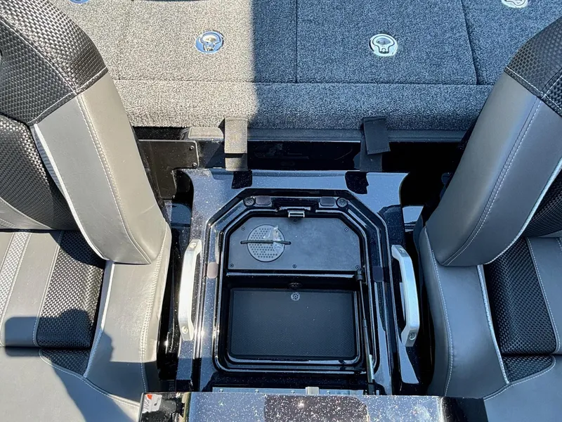 Slide: The Image of 2025 Ranger Z520R Garmin Ranger Cup interior seating and storage compartment. - 14
