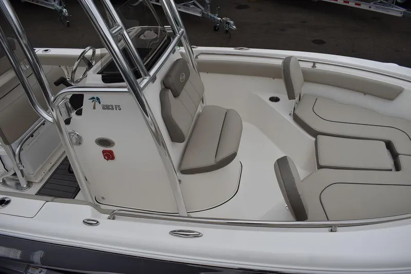 Slide: The Image of 2024 Key West 203 FS boat interior with beige seating and console. - 16