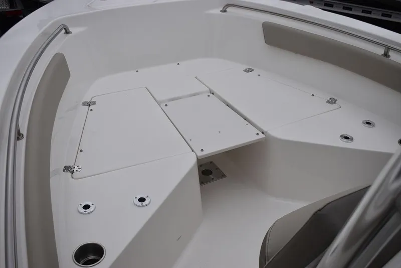 Slide: The Image of 2024 Key West 203 FS boat interior with storage compartments and seating. - 26