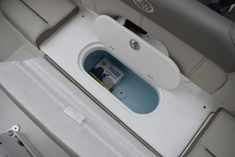 Slide: The Image of 2024 Key West 203 FS boat storage compartment with beverage cooler. - 29