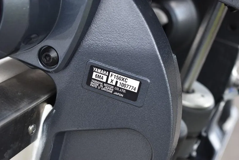 Slide: The Image of Close-up of Yamaha F150XC engine label on 2024 Key West 203 FS boat. - 33
