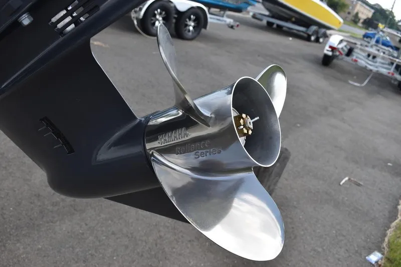 Slide: The Image of Close-up of a 2024 Key West 203 FS boat propeller in a parking lot. - 34