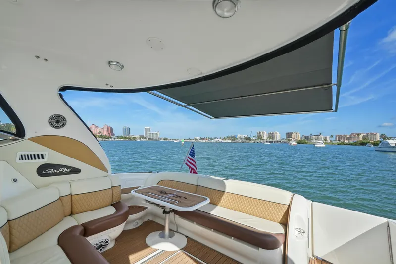 Slide: The Image of Sea Ray 510 Sundancer 2001 yacht interior with waterfront view and seating area. - 12