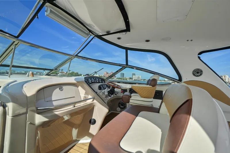 Slide: The Image of Interior view of 2001 Sea Ray 510 Sundancer yacht cockpit with leather seating. - 14