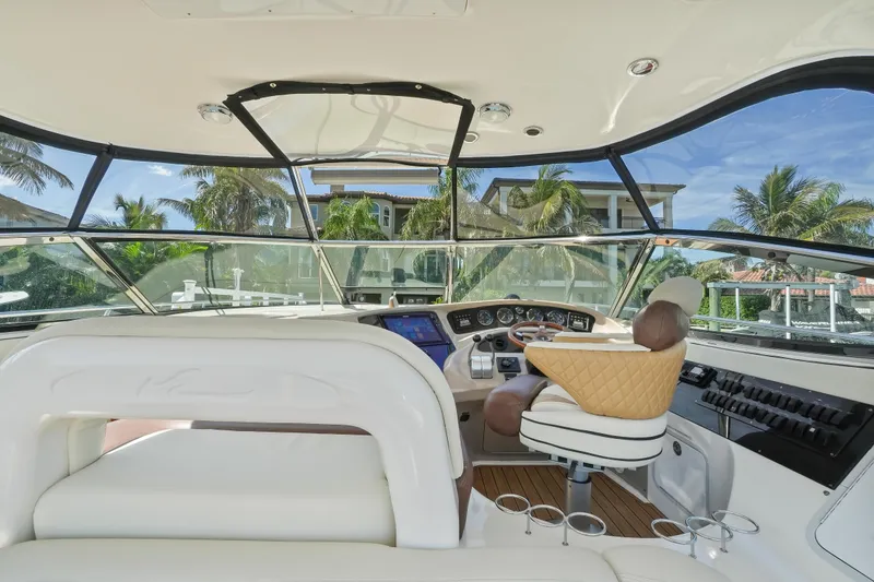Slide: The Image of Interior view of 2001 Sea Ray 510 Sundancer yacht cockpit with luxurious seating. - 18