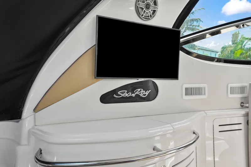 Slide: The Image of Interior of 2001 Sea Ray 510 Sundancer yacht with TV and Sea Ray logo. - 24